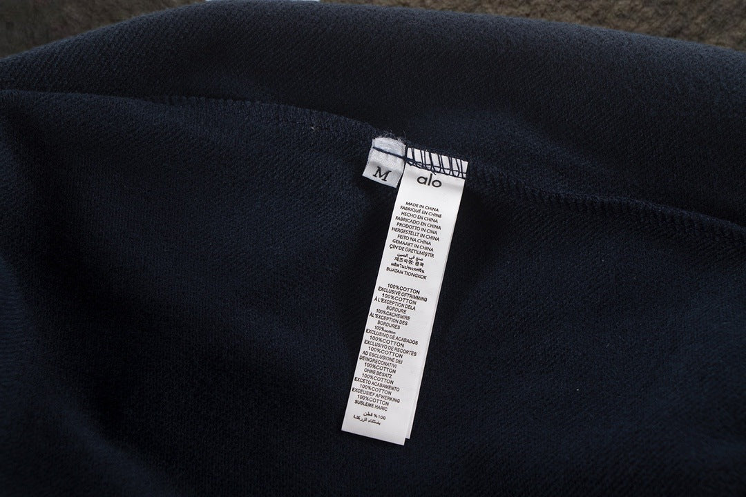 Sudadera Alo Yoga con Capucha Logo Metálico Azul Marino — etiqueta interior